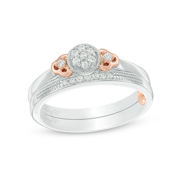 1/8 CT. T.w. Composite Diamond Flower-Sides Interlocking Bridal Set in 10K Two-Tone Gold