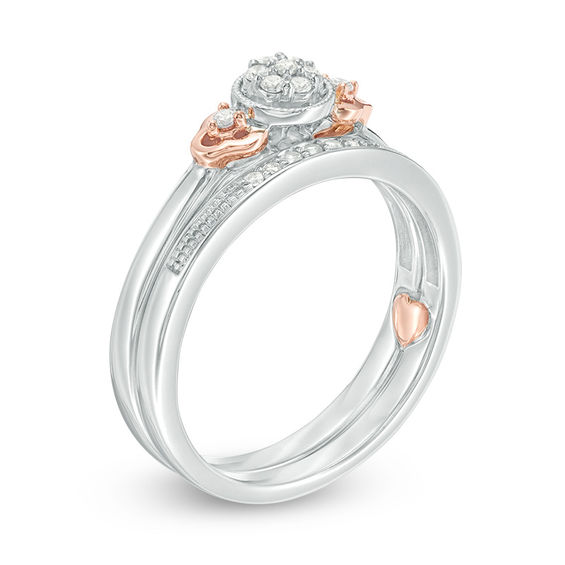 1/8 CT. T.w. Composite Diamond Flower-Sides Interlocking Bridal Set in 10K Two-Tone Gold