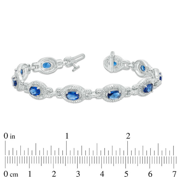 Oval Lab-Created Blue Sapphire and 1/20 CT. T.w. Diamond Frame Link Bracelet in Sterling Silver - 7.5"