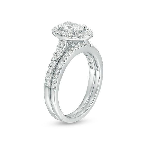 Celebration Ideal 1-1/2 CT. T.w. Oval Certified Diamond Frame Bridal Set in 14K White Gold (I/I1)