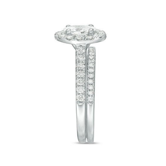 Celebration Ideal 1-1/2 CT. T.w. Oval Certified Diamond Frame Bridal Set in 14K White Gold (I/I1)