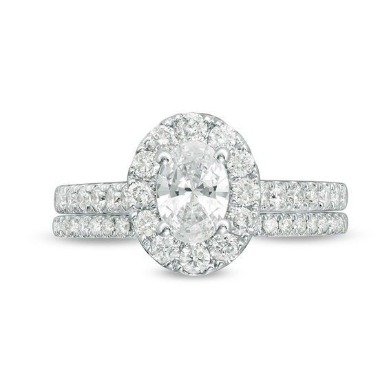 Celebration Ideal 1-1/2 CT. T.w. Oval Certified Diamond Frame Bridal Set in 14K White Gold (I/I1)