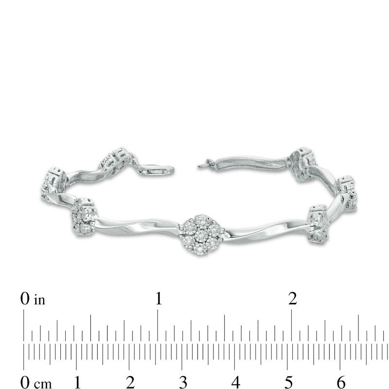 1/4 CT. T.W. Diamond Flower Twist Bracelet in Sterling Silver - 7.25"