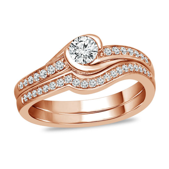 1/2 CT. T.w. Diamond Swirl Bypass Bridal Set in 10K Rose Gold