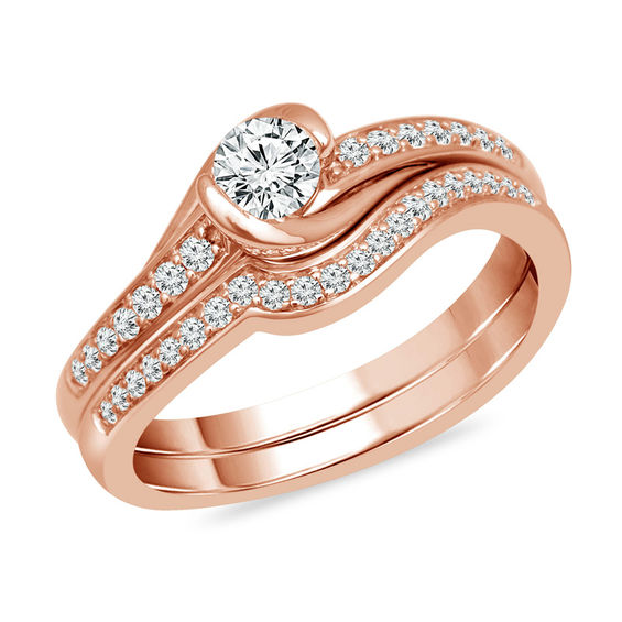 1/2 CT. T.w. Diamond Swirl Bypass Bridal Set in 10K Rose Gold