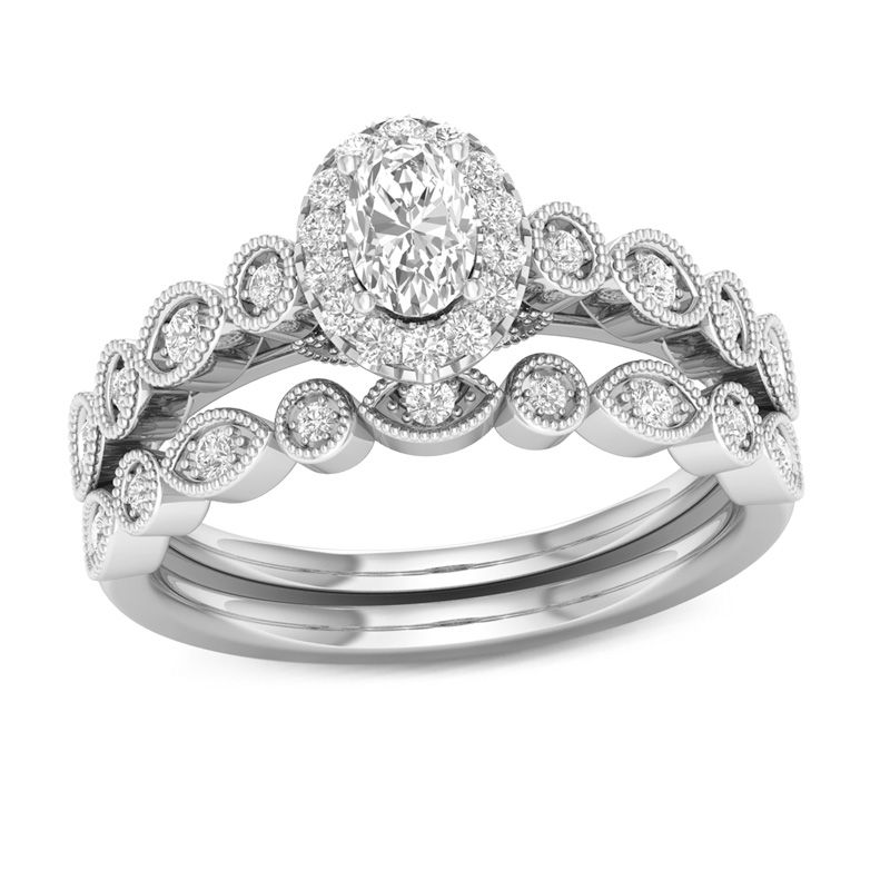 Main Image 1 of 1/2 CT. T.W. Oval Diamond Frame Bridal Set in 14K Gold