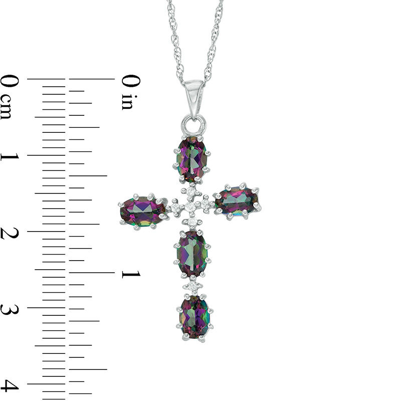 Oval Mystic Fire® Topaz and 1/20 CT. T.W. Diamond Cross Pendant in Sterling Silver
