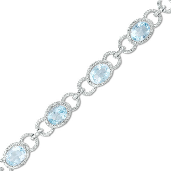 Oval Sky Blue Topaz and 1/20 CT. T.W. Diamond Beaded Buckle Bracelet in Sterling Silver - 7.5" Oval Sky Blue Topaz and 1/20 CT. T.W. Diamond Beaded Buckle Bracelet in Sterling Silver - 7.5"