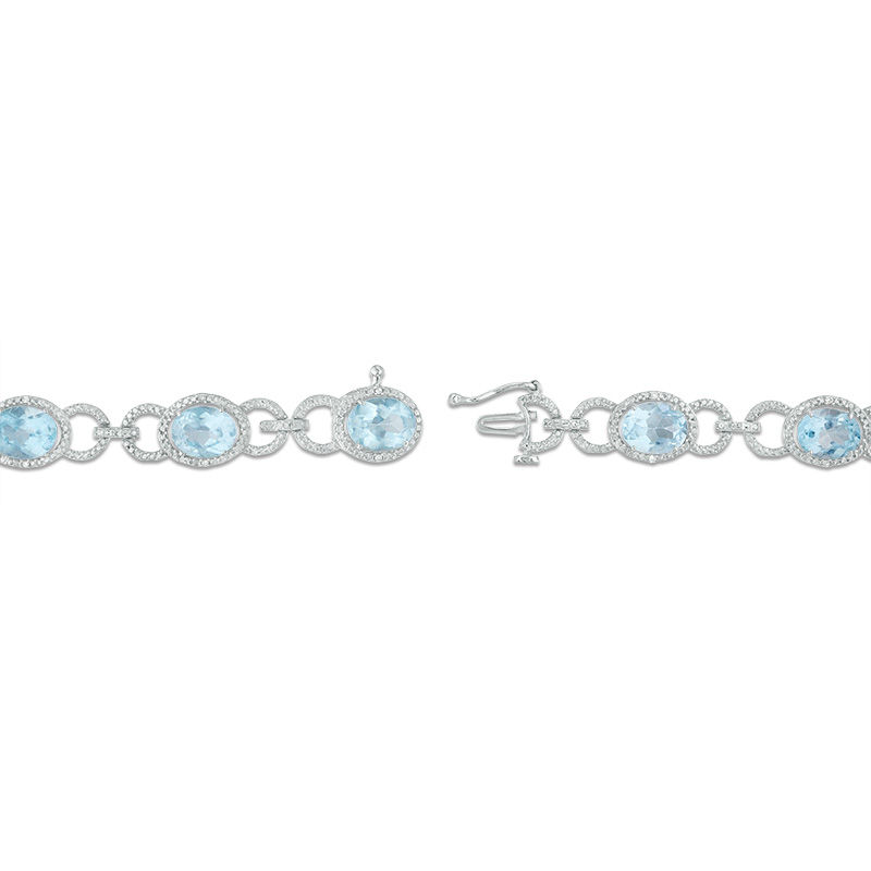 Oval Sky Blue Topaz and 1/20 CT. T.W. Diamond Beaded Buckle Bracelet in Sterling Silver - 7.5"