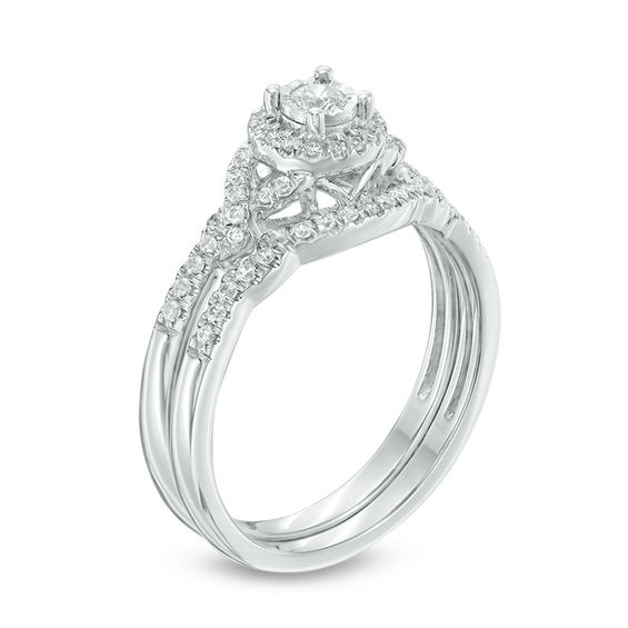 1/3 CT. T.w. Diamond Frame Twist Bridal Set in 10K White Gold