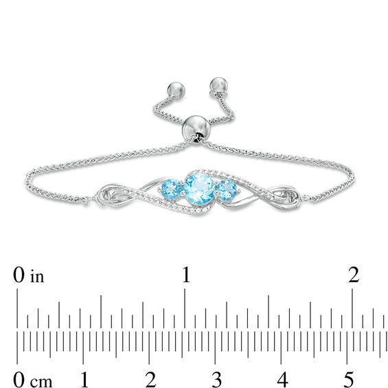 Swiss Blue Topaz and Lab-Created White Sapphire Infinity Pendant, Earrings and Bracelet Set in Sterling Silver - 9.5"