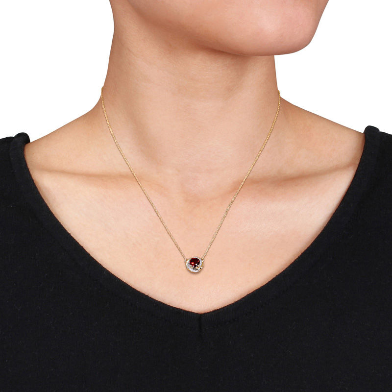 6.0mm Garnet and 1/20 CT. T.W. Diamond Orbit Frame Necklace in 10K Gold - 17"