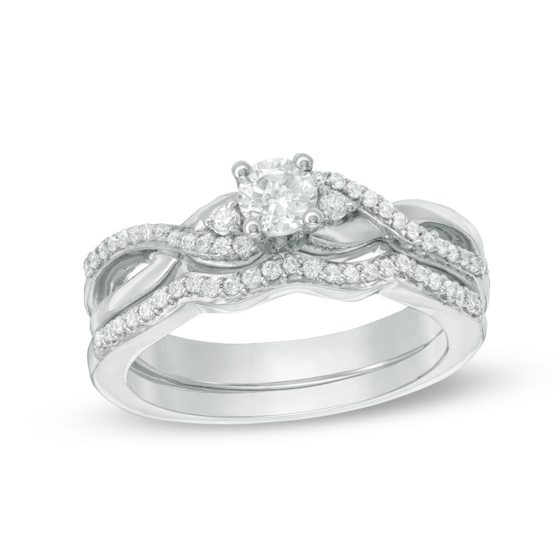 Main Image 1 of 1/3 CT. T.W. Diamond Three Stone Twist Bridal Set in Sterling Silver