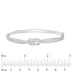 Thumbnail Image 1 of 1/4 CT. T.W. Diamond Bypass Double Loop Knot Bangle in Sterling Silver - 7.5"