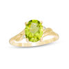 Thumbnail Image 0 of Oval Peridot and Diamond Accent Bypass Swirl Shank Ring in 10K Gold