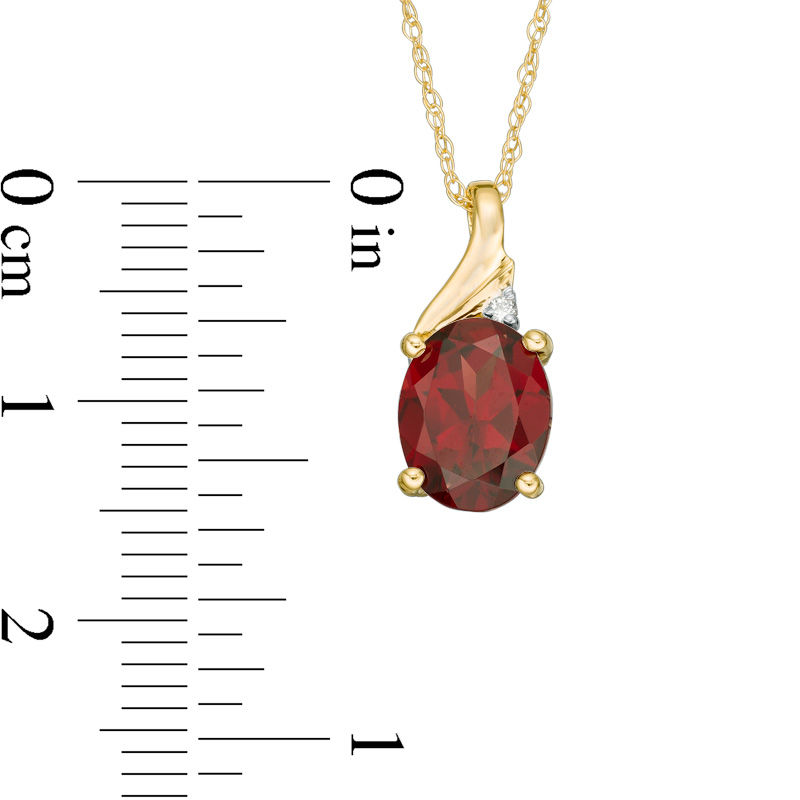 Oval Garnet and Diamond Accent Swirl Top Pendant in 10K Gold