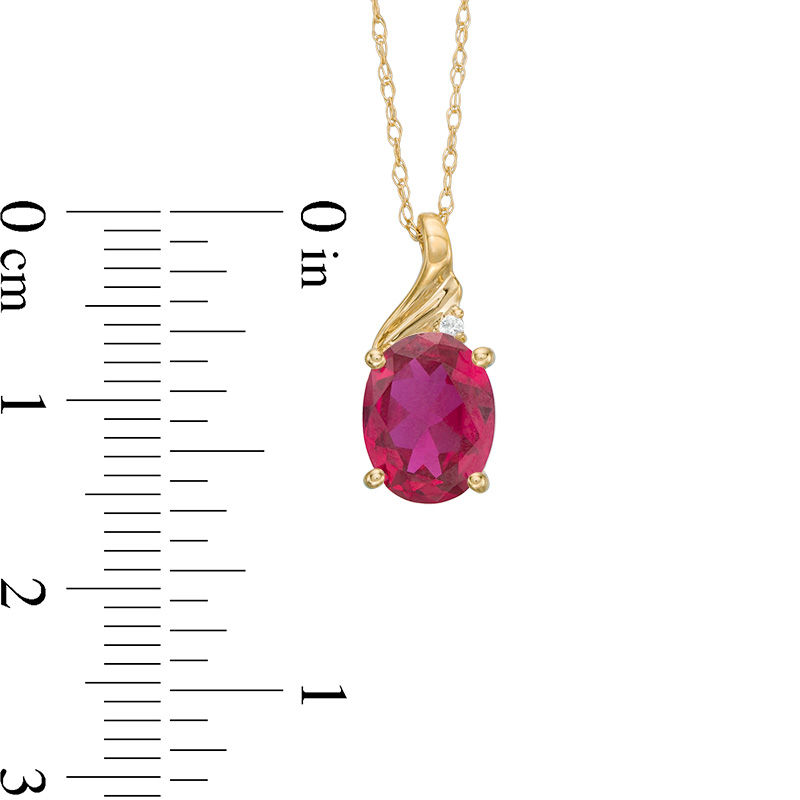 Oval Lab-Created Ruby and Diamond Accent Swirl Top Pendant in 10K Gold