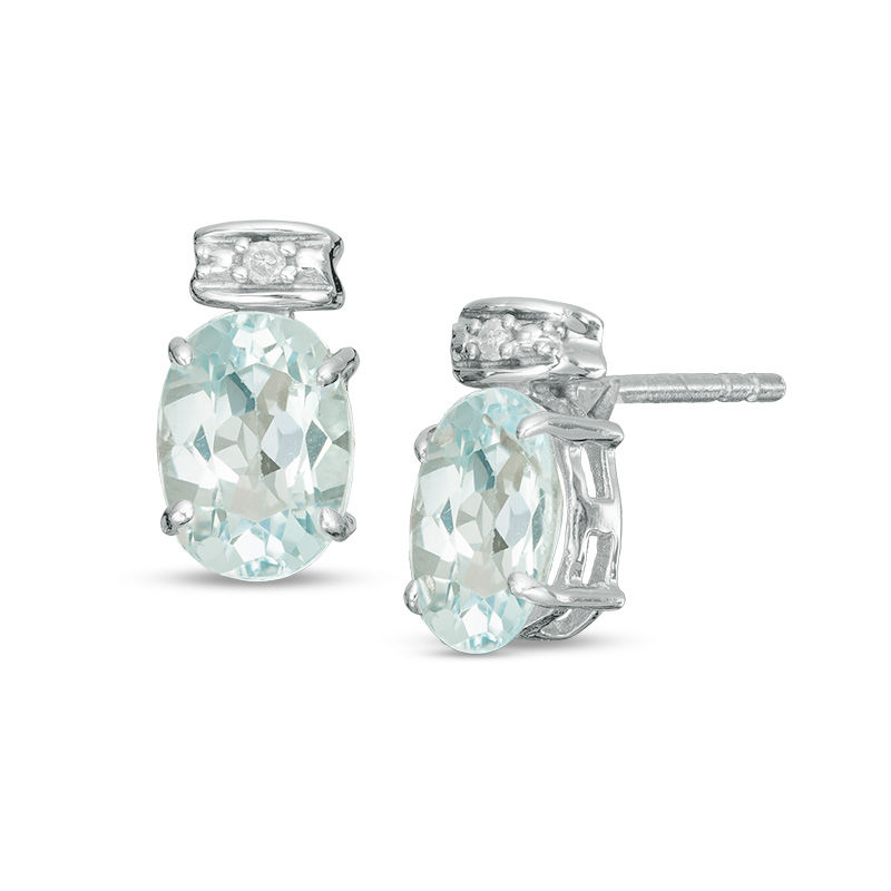 Oval Blue Topaz and Diamond Accent Stud Earrings in Sterling Silver
