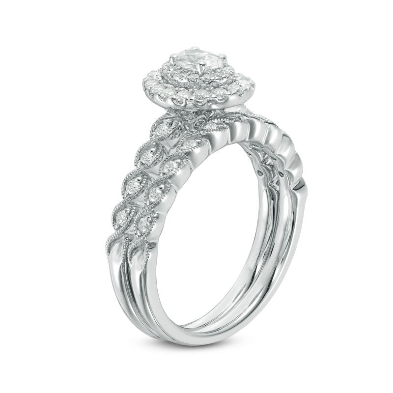 3/4 CT. T.W. Oval Diamond Double Frame Twist Vintage-Style Bridal Set in 14K White Gold