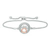 Thumbnail Image 0 of 1/15 CT. T.W. Diamond Open Circle with Paw Print Bolo Bracelet in Sterling Silver and 10K Rose Gold (1 Line) - 9.5"