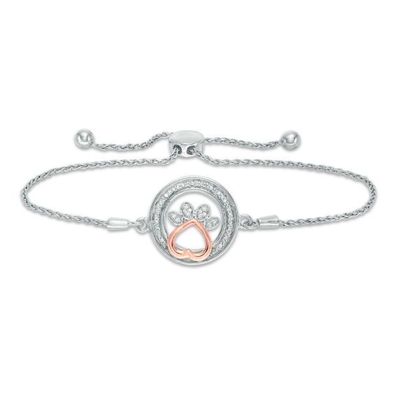 1/15 CT. T.W. Diamond Open Circle with Paw Print Bolo Bracelet in Sterling Silver and 10K Rose Gold (1 Line) - 9.5" 1/15 CT. T.W. Diamond Open Circle with Paw Print Bolo Bracelet in Sterling Silver and 10K Rose Gold (1 Line) - 9.5"