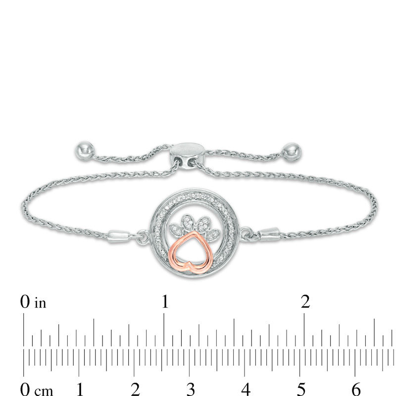 1/15 CT. T.W. Diamond Open Circle with Paw Print Bolo Bracelet in Sterling Silver and 10K Rose Gold (1 Line) - 9.5"