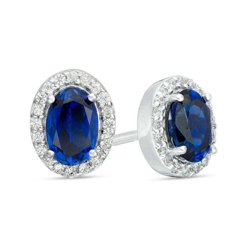 Main Image 1 of Oval Lab-Created Blue Sapphire and 1/8 CT. T.W. Diamond Frame Stud Earrings in 10K White Gold