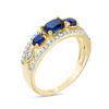 Thumbnail Image 2 of Sideways Oval Lab-Created Blue Sapphire and 1/4 CT. T.W. Diamond Three Stone Ring in 10K Gold