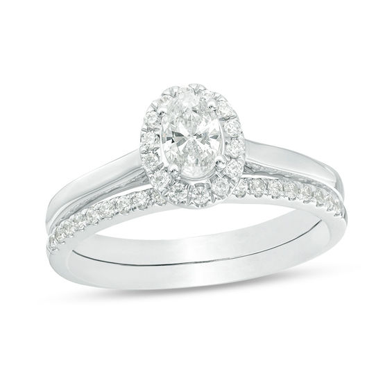 3/4 CT. T.w. Oval Diamond Frame Bridal Set in 14K White Gold