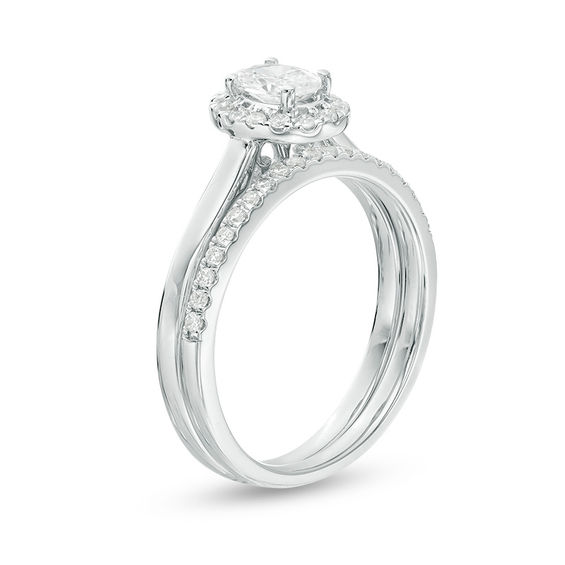 3/4 CT. T.w. Oval Diamond Frame Bridal Set in 14K White Gold