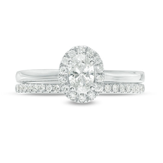 3/4 CT. T.w. Oval Diamond Frame Bridal Set in 14K White Gold