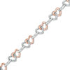 Thumbnail Image 0 of 1/10 CT. T.W. Diamond Interlocking Hearts Bracelet in Sterling Silver and 10K Rose Gold - 7.25"