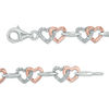 Thumbnail Image 2 of 1/10 CT. T.W. Diamond Interlocking Hearts Bracelet in Sterling Silver and 10K Rose Gold - 7.25"