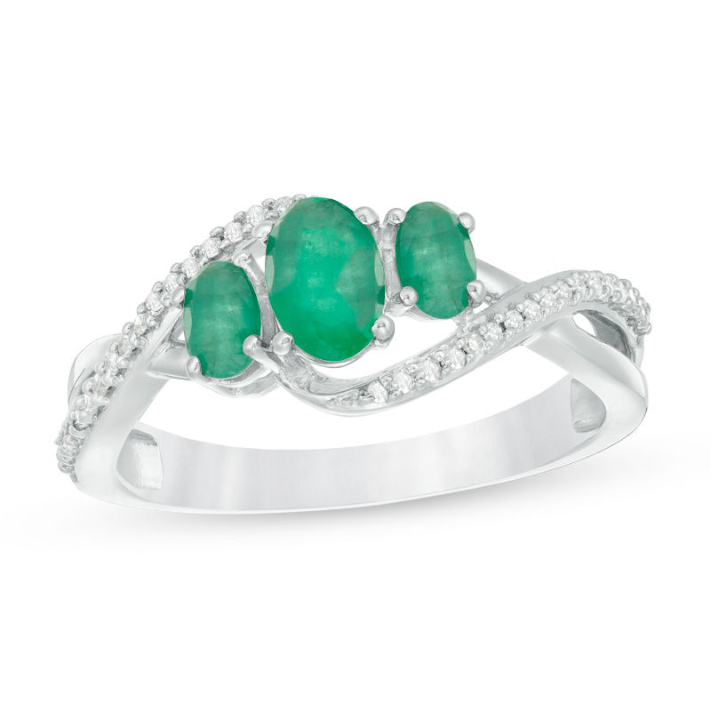 Oval Emerald and 1/10 CT. T.W. Diamond Three Stone Crossover Bypass Ring in 10K White Gold