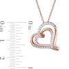 Thumbnail Image 1 of 1/4 CT. T.W. Diamond Tilted Double Heart Pendant in 10K Rose Gold