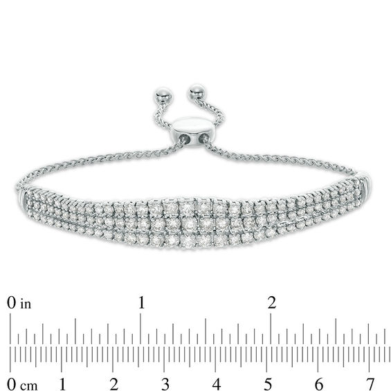 3 CT. T.W. Diamond Graduated Three Row Bolo Bracelet in 10K White Gold - 9.5" 3 CT. T.W. Diamond Graduated Three Row Bolo Bracelet in 10K White Gold - 9.5"