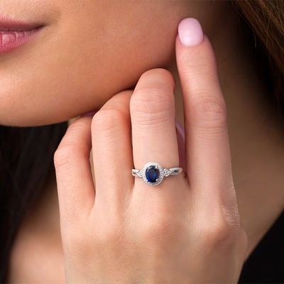 Oval Lab-Created Blue Sapphire and 1/8 CT. T.W. Diamond Frame