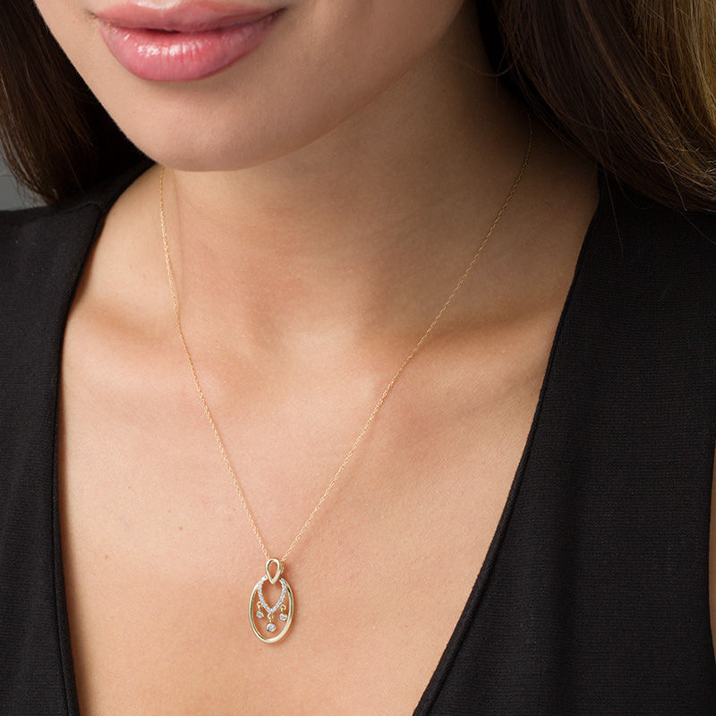 Main Image 2 of 1/8 CT. T.W. Diamond Teardrop and Oval Dangle Pendant in 10K Gold