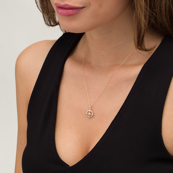 1/15 CT. T.w. Diamond Compass "Nesw" Pendant in 10K Gold
