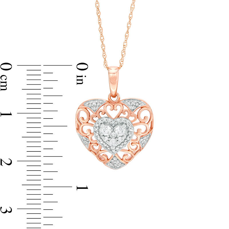 Main Image 2 of 1/4 CT. T.W. Diamond Filigree Heart Pendant in 10K Two-Tone Gold