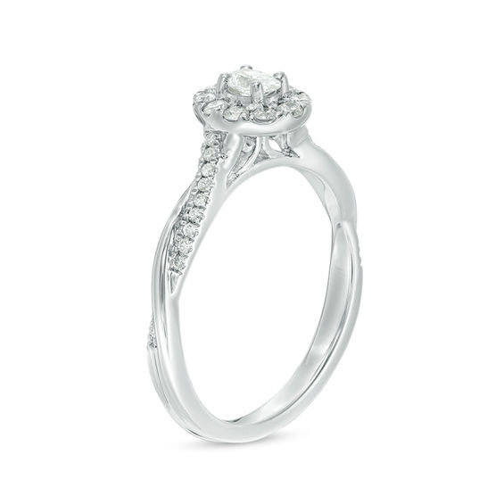 3/8 CT. T.w. Oval Diamond Frame Twist Engagement Ring in 10K White Gold