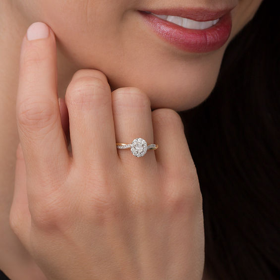 3/8 CT. T.w. Oval Diamond Frame Twist Engagement Ring in 10K Gold