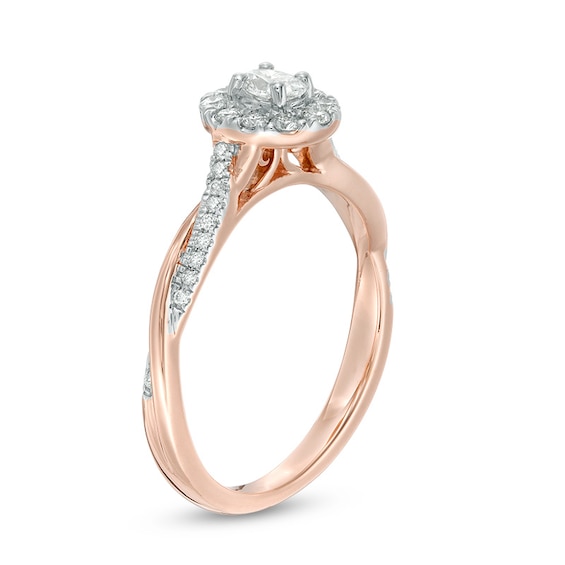 3/8 CT. T.w. Oval Diamond Frame Twist Engagement Ring in 10K Rose Gold