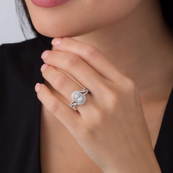 1-1/2 CT. T.w. Certified Oval Diamond Frame Bypass Swirl Engagement Ring in 14K White Gold (I/Si2)