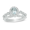 Thumbnail Image 1 of Oval Aquamarine and 1/5 CT. T.W. Diamond Frame Vintage-Style Bridal Set in 10K White Gold