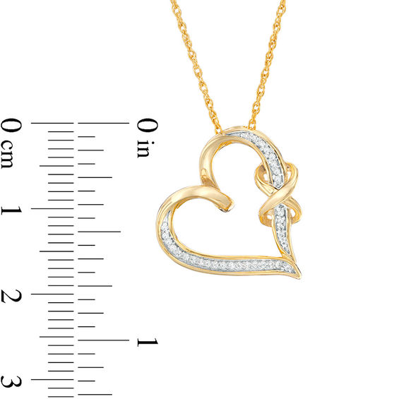 1/15 CT. T.w. Diamond Infinity Knot Tilted Heart Pendant in Sterling Silver with 14K Gold Plate
