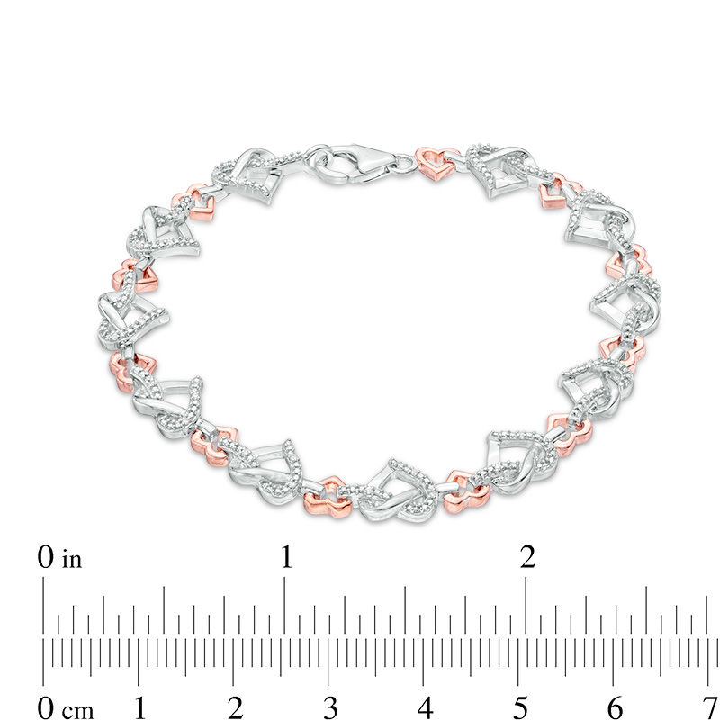 1/10 CT. T.W. Diamond Love Knot Heart Bracelet in Sterling Silver and 10K Rose Gold