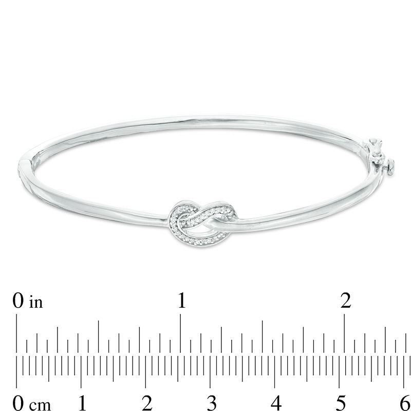 1/15 CT. T.W. Diamond Love Knot Pretzel Bangle in Sterling Silver