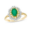 Thumbnail Image 1 of Oval Emerald and 1/3 CT. T.W. Diamond Double Floral Frame Ring in 10K Gold