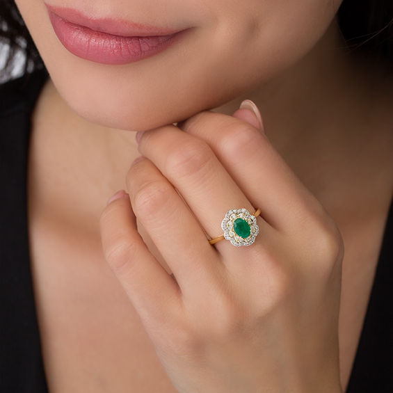 Oval Emerald and 1/3 CT. T.w. Diamond Double Floral Frame Ring in 10K Gold